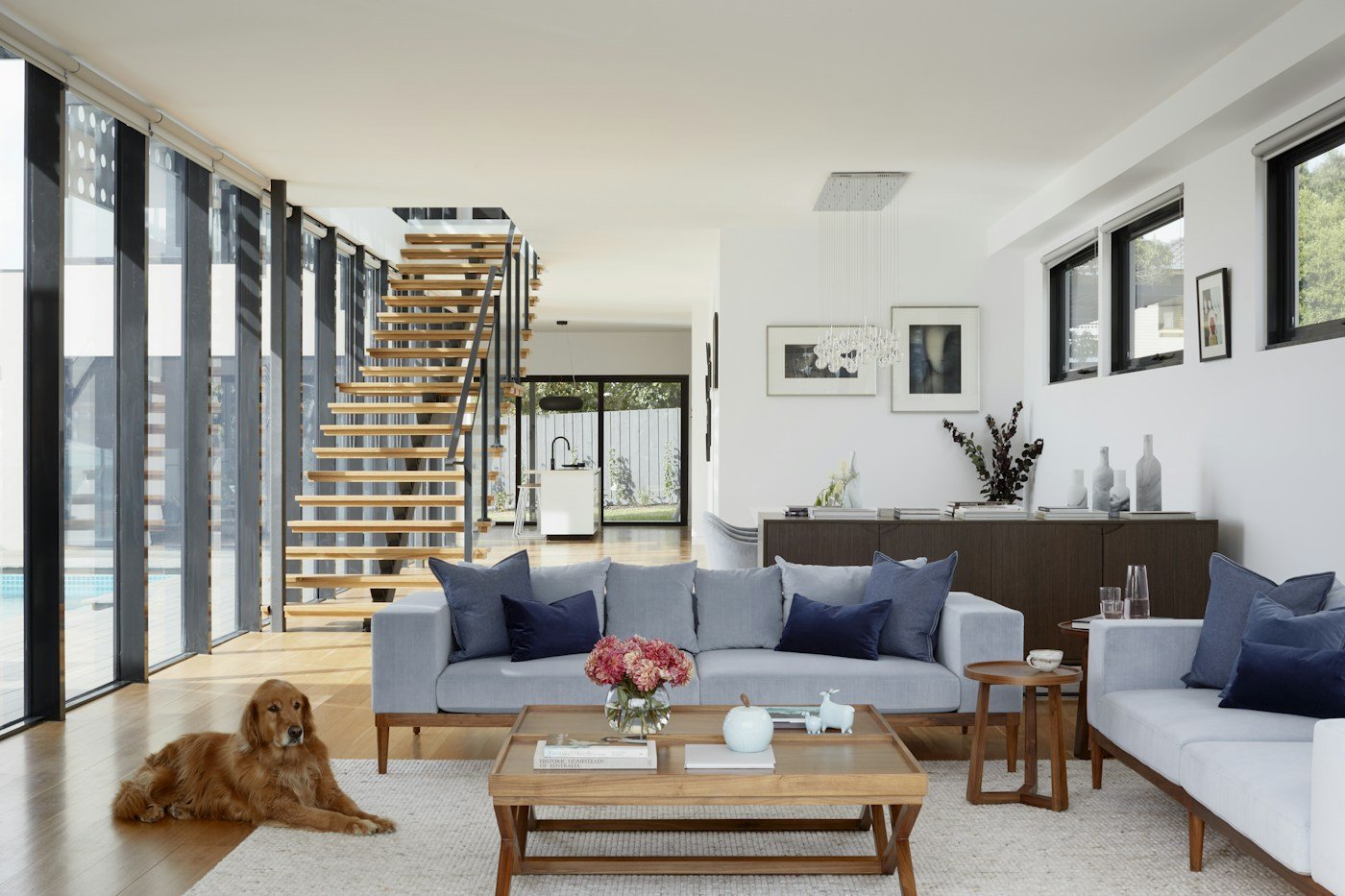 An open-plan home with natural light, timber and carefully layered furnishings